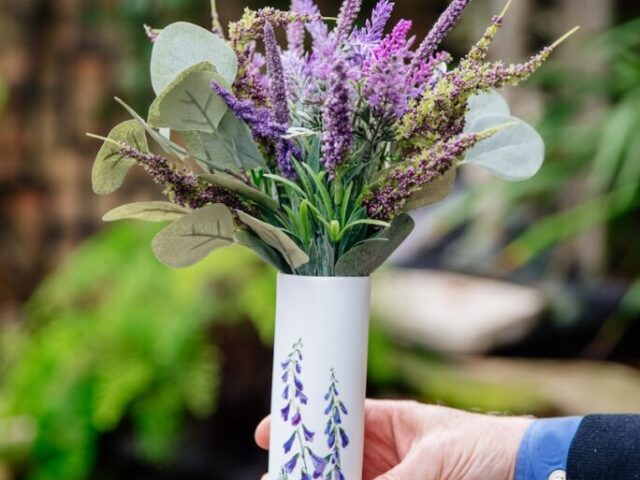 faux floral arrangement in a delicate white vase