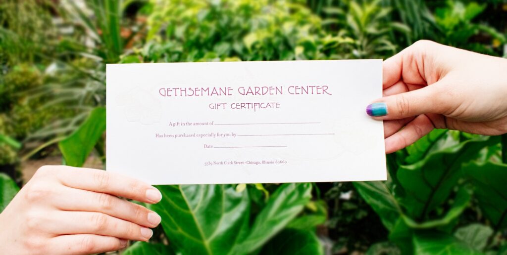 two hands holding a Gethsemane gift certificate